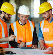 Three men making plans for construction work