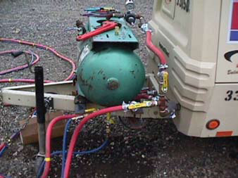 Photo of a water tank mounted on a compressor trailer