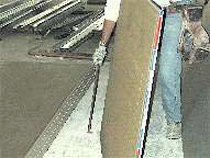 Panel carrier handle puts hand at a good height from the floor for lifting.
