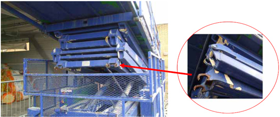 photo and photo detail of sheared base pivot–pin connectors that caused collapse