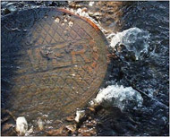 Photo of submerged manhole cover