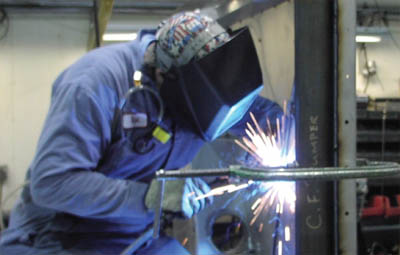 Photo of man welding