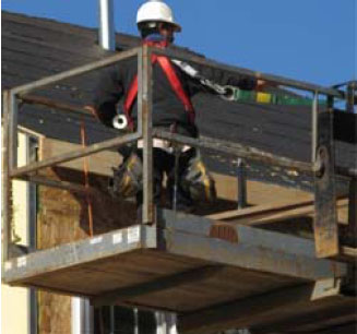Figure 30 - Worker performing residential construction activities from an aerial lift.