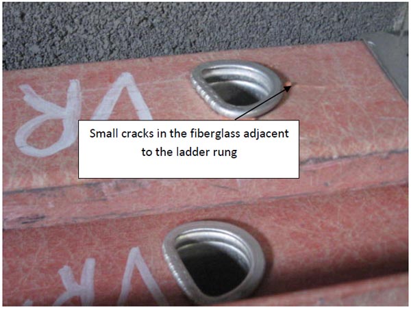 close up photo showing small cracks in the fiberglass adjacent to the ladder rung