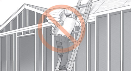 Worker improperly climbing ladder with heavy roof tiles