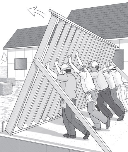 Five workers raising stud wall together