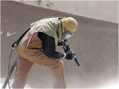 worker with machine making dust