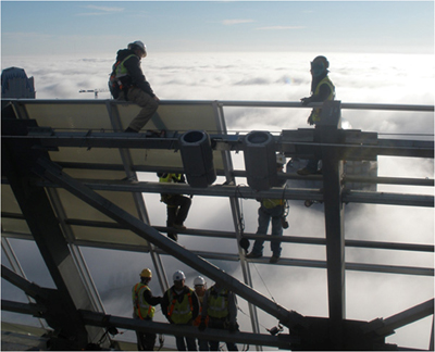 Photo: 2nd place in OSHA’s 2011 photo contest, construction workers working in the clouds. Courtesy Roberto Carlos Vergara of Charlotte, North Carolina. 