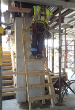 Photo of a worker on a ladder
